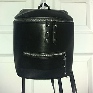 Small, black, faux leather bag/backpack